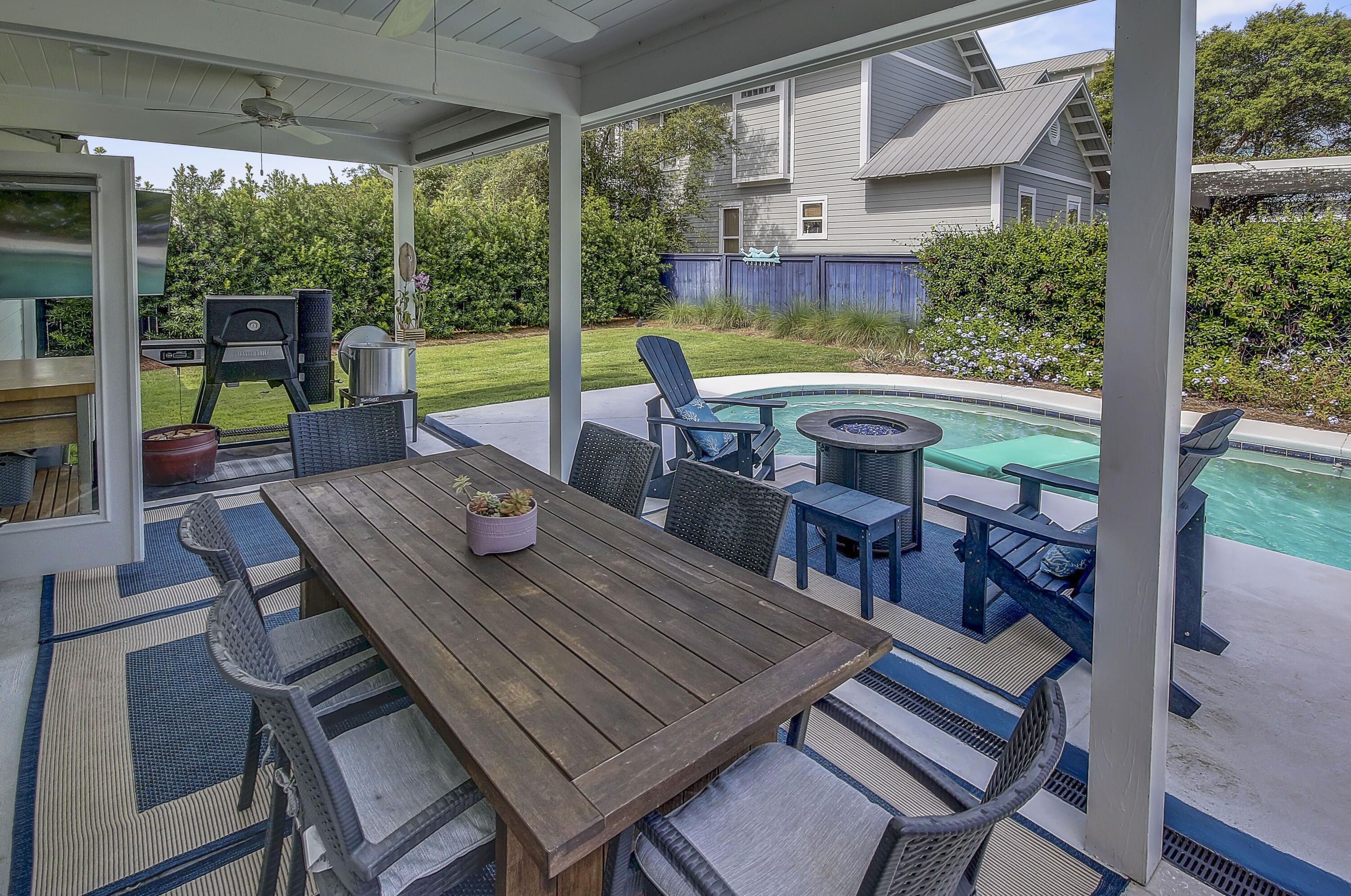 59 Walton Gulfview Drive Inlet Beach, FL 32461 - Photo 18 of 26 a view of a patio with a table chairs and a backyard