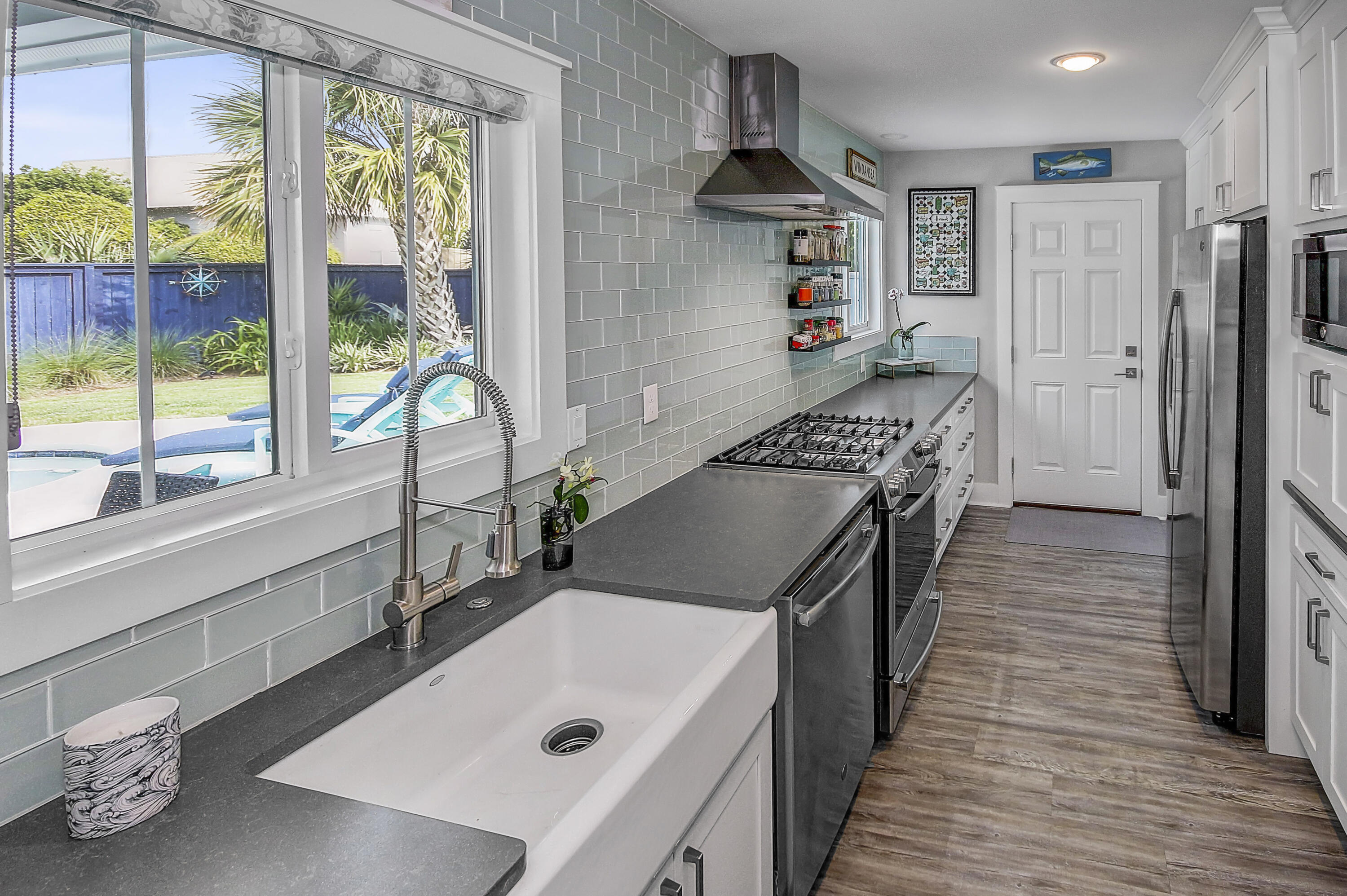 59 Walton Gulfview Drive Inlet Beach, FL 32461 - Photo 9 of 26 a kitchen with sink refrigerator and window