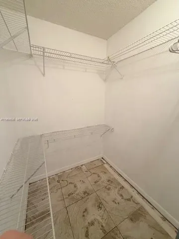 a view of a room with racks on the wall