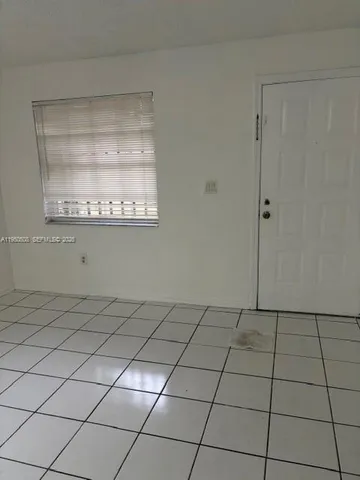 a view of a livingroom and window
