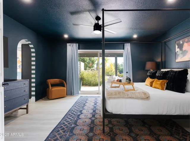 a view of a patio with table and chairs potted plants with wooden floor