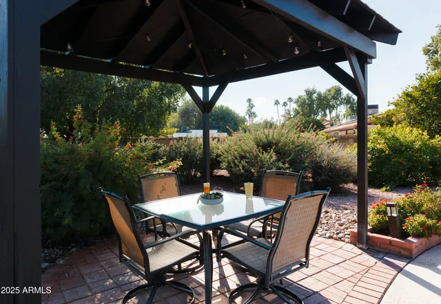 a living room with furniture a flat screen tv and a large window