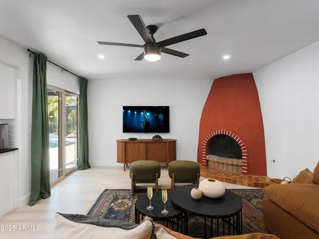 a living room with furniture and kitchen view