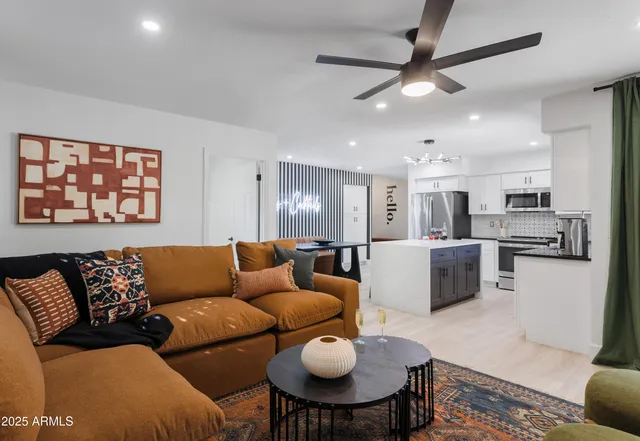 a living room with furniture and a window