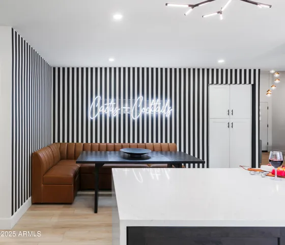 a kitchen with a sink a counter top stainless steel appliances and cabinets