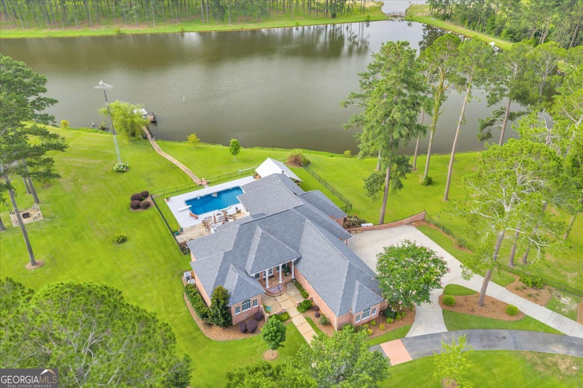 an aerial view of a house with a lake view
