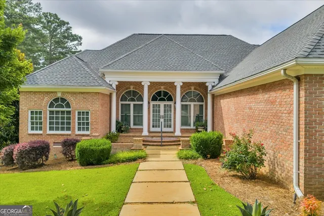 a kitchen with stainless steel appliances granite countertop a stove and a refrigerator