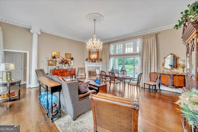 a living room with fireplace furniture and a flat screen tv