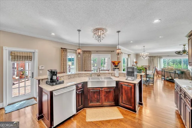 a spacious bathroom with a toilet a sink and a mirror