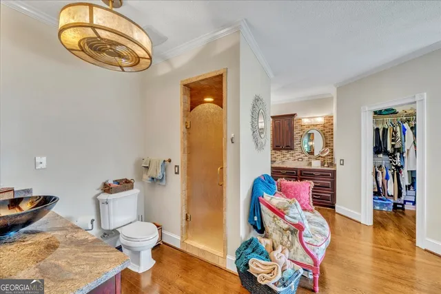 a living room with furniture and floor to ceiling windows