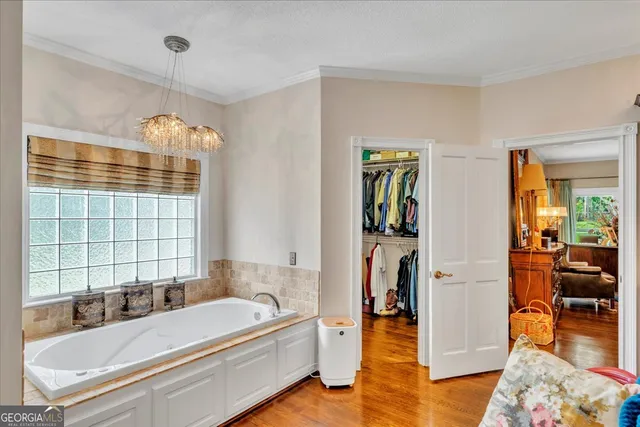 a front view of a house with yard porch and sitting area