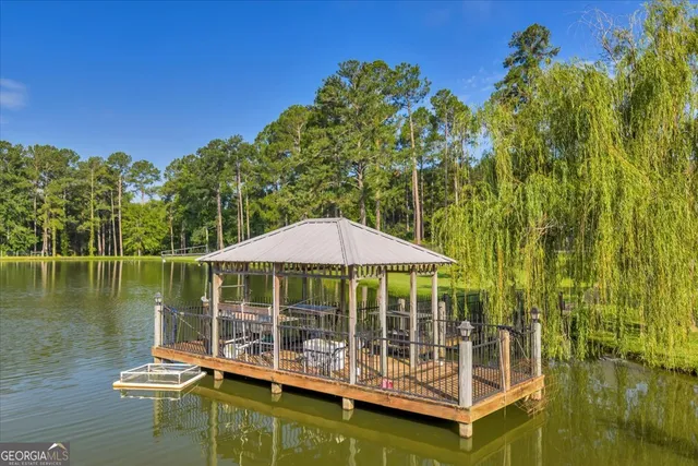a living room with fireplace furniture and a wooden floor
