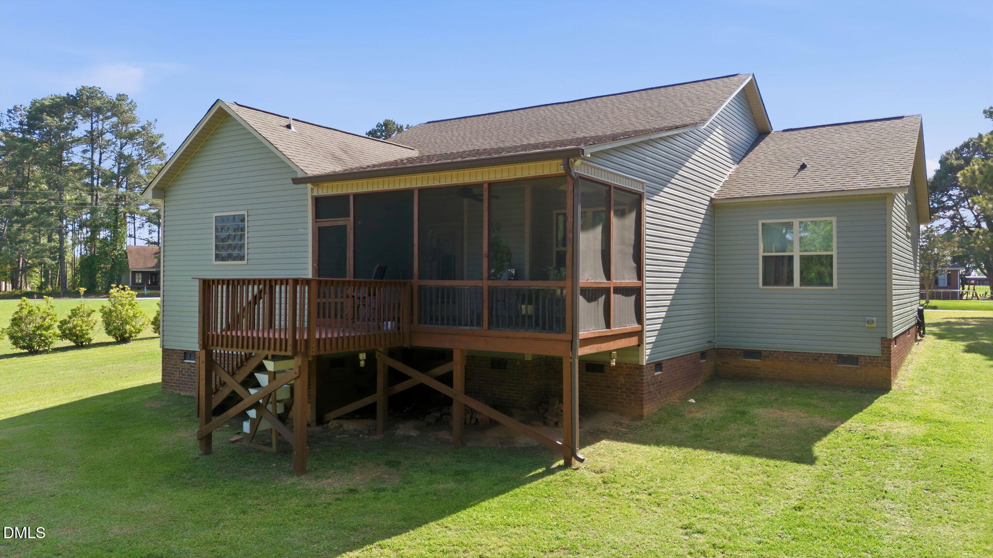 1547 Lassiter Pond Road Four Oaks, NC 27524 - Photo 7 of 45 a house view with a seating space and garden