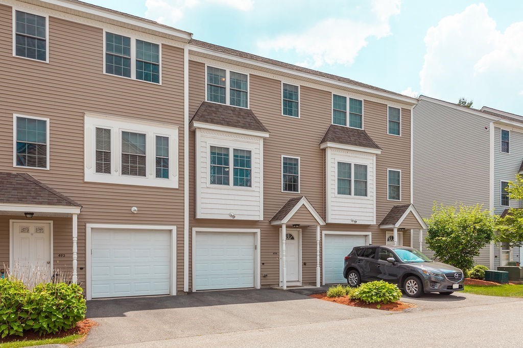 41 Boston Road, Unit 494 Billerica, MA 01862 - Photo 1 of 22 a front view of a house with parking