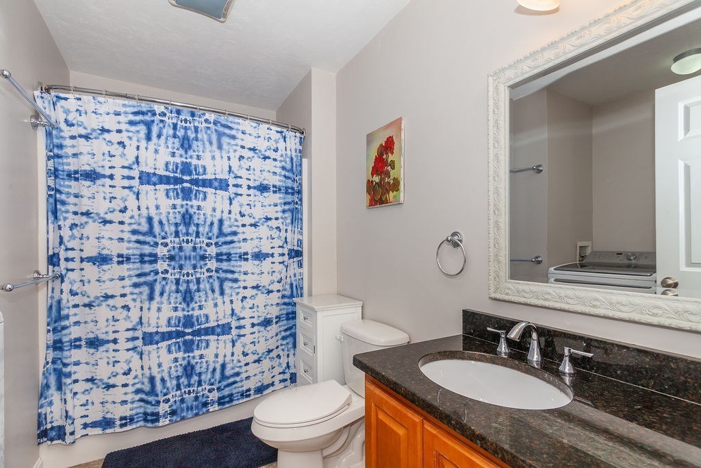 41 Boston Road, Unit 494 Billerica, MA 01862 - Photo 11 of 22 a bathroom with a granite countertop double vanity sink mirror and toilet