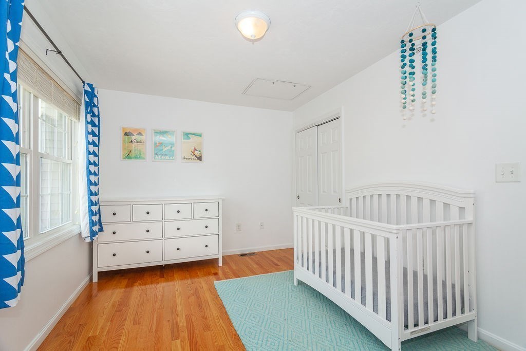 41 Boston Road, Unit 494 Billerica, MA 01862 - Photo 12 of 22 a bedroom with furniture and baby crib