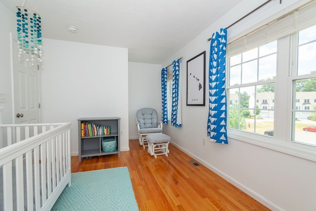 41 Boston Road, Unit 494 Billerica, MA 01862 - Photo 13 of 22 a living room with furniture and a wooden floor
