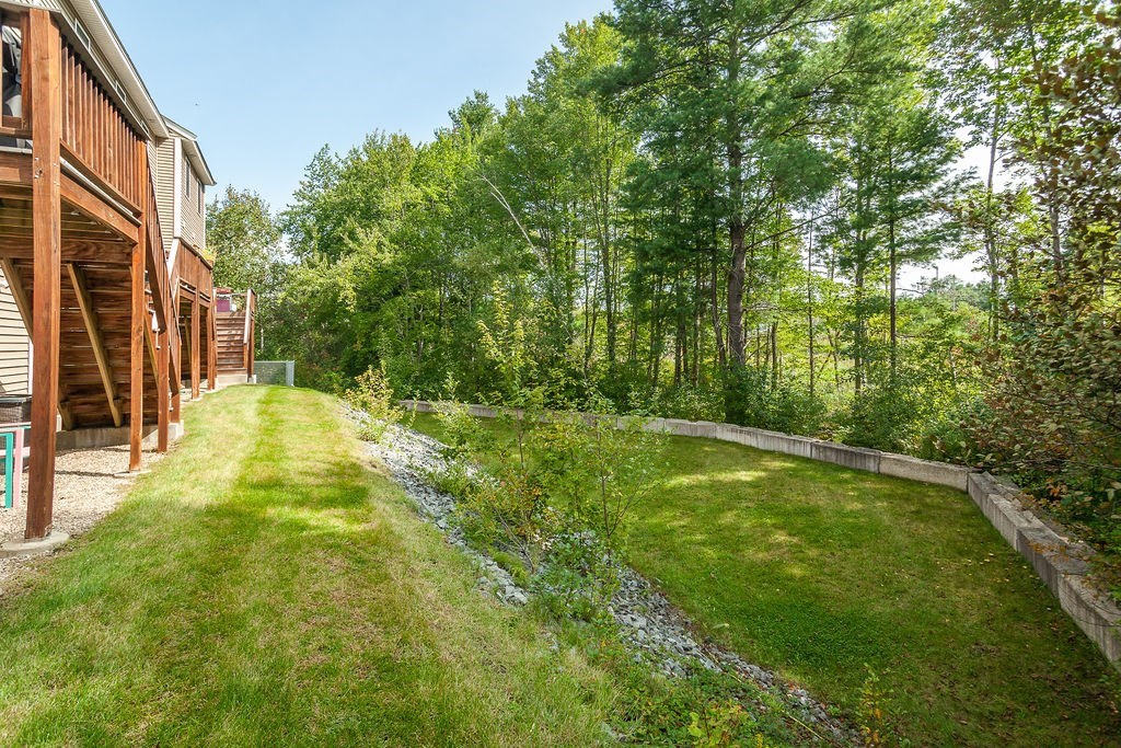 41 Boston Road, Unit 494 Billerica, MA 01862 - Photo 16 of 22 a view of swimming pool with lawn chairs and large trees