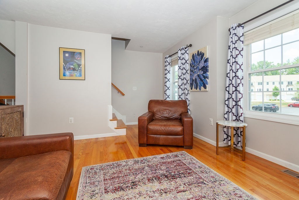 41 Boston Road, Unit 494 Billerica, MA 01862 - Photo 3 of 22 a living room with furniture and a rug