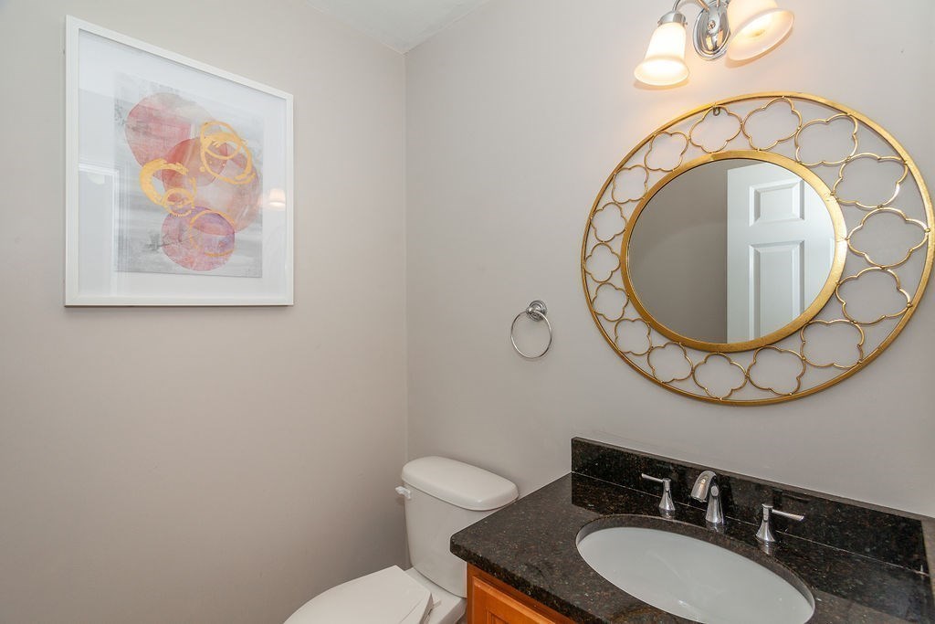 41 Boston Road, Unit 494 Billerica, MA 01862 - Photo 8 of 22 a bathroom with a toilet a sink and a mirror