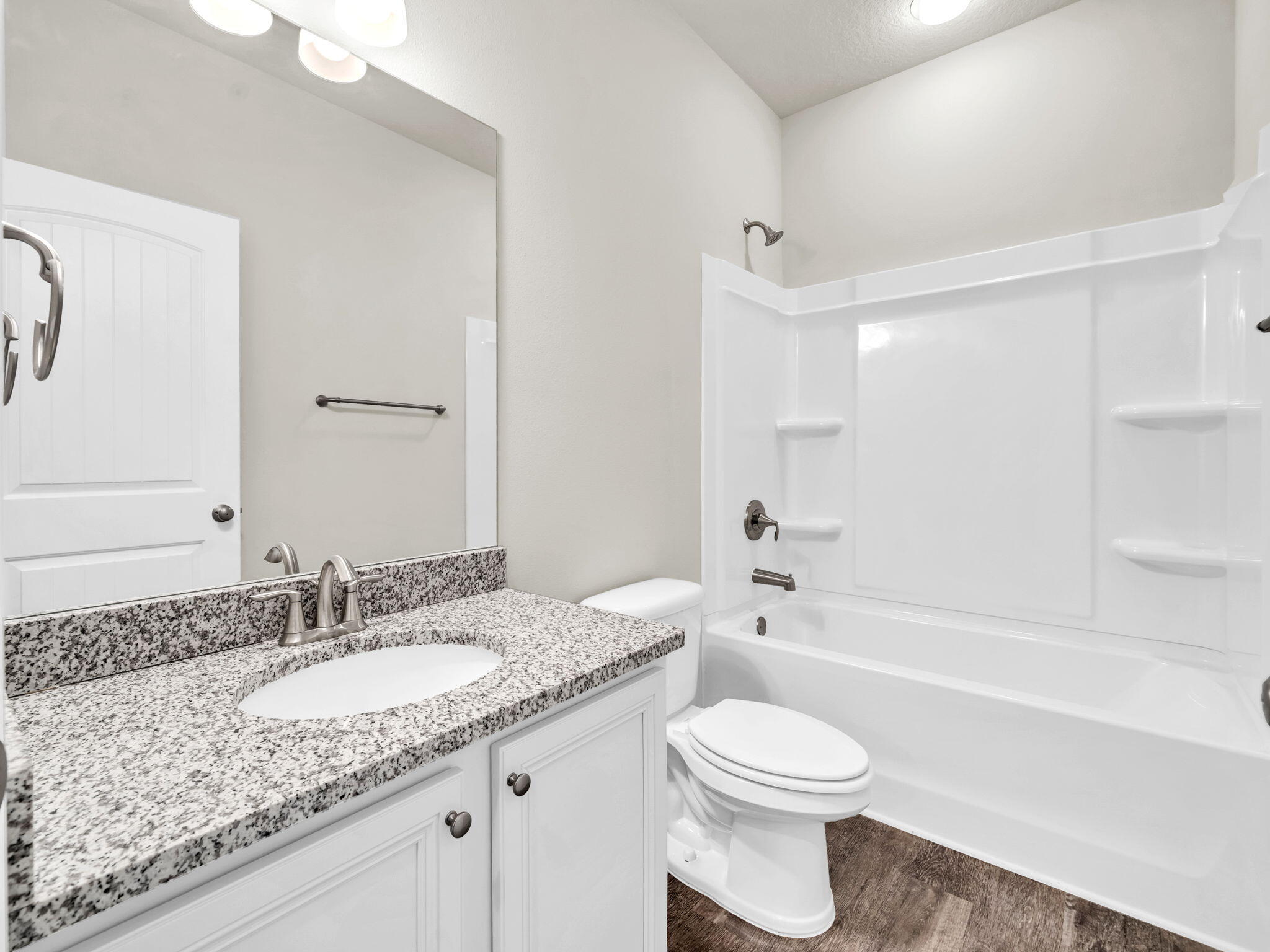 218 Stonegate Drive Santa Rosa Beach, FL 32459 - Photo 28 of 37 a bathroom with a granite countertop toilet sink and bathtub