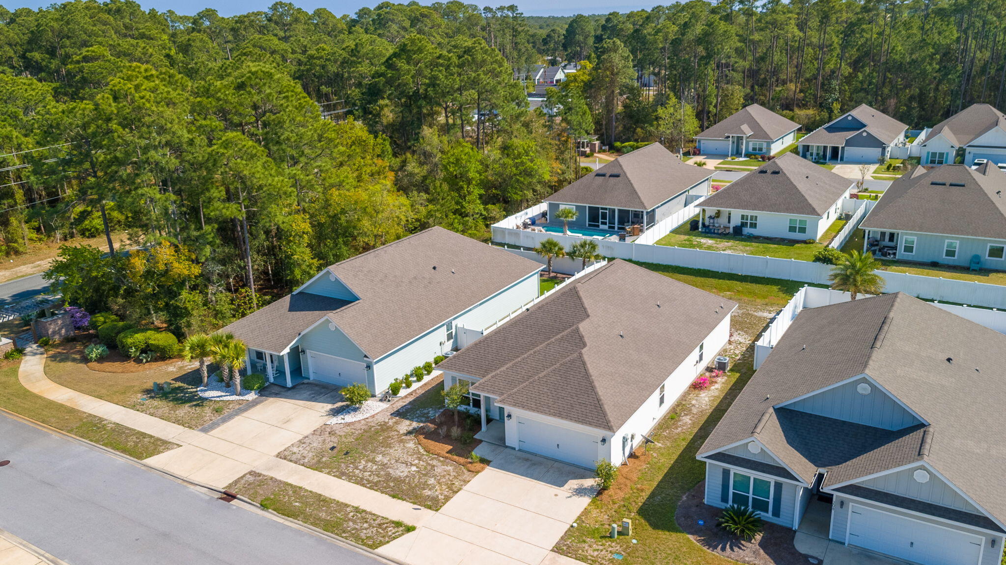 218 Stonegate Drive Santa Rosa Beach, FL 32459 - Photo 3 of 37 an aerial view of a house with swimming pool and outdoor seating