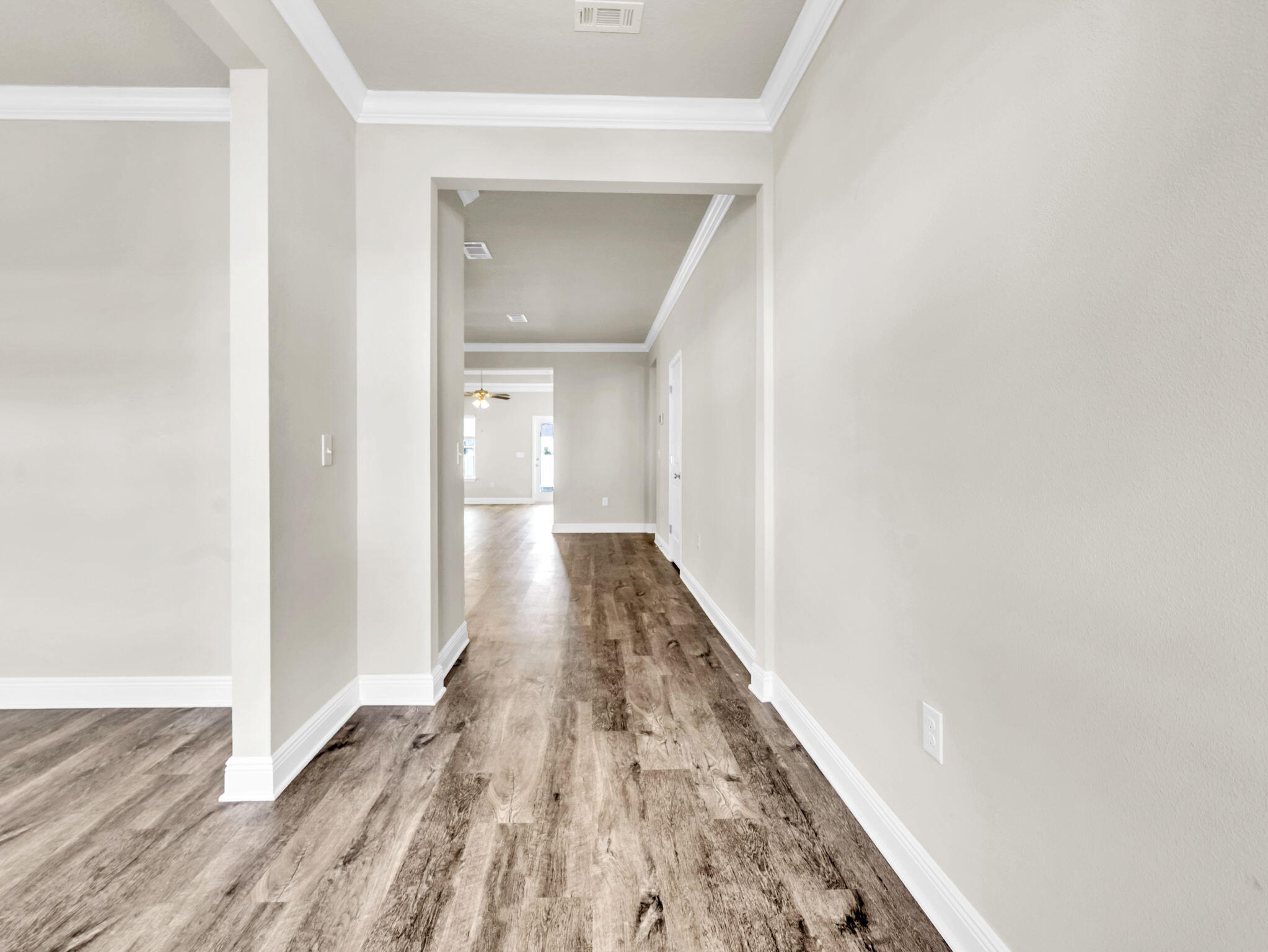 218 Stonegate Drive Santa Rosa Beach, FL 32459 - Photo 8 of 37 a view of a hallway with wooden floor