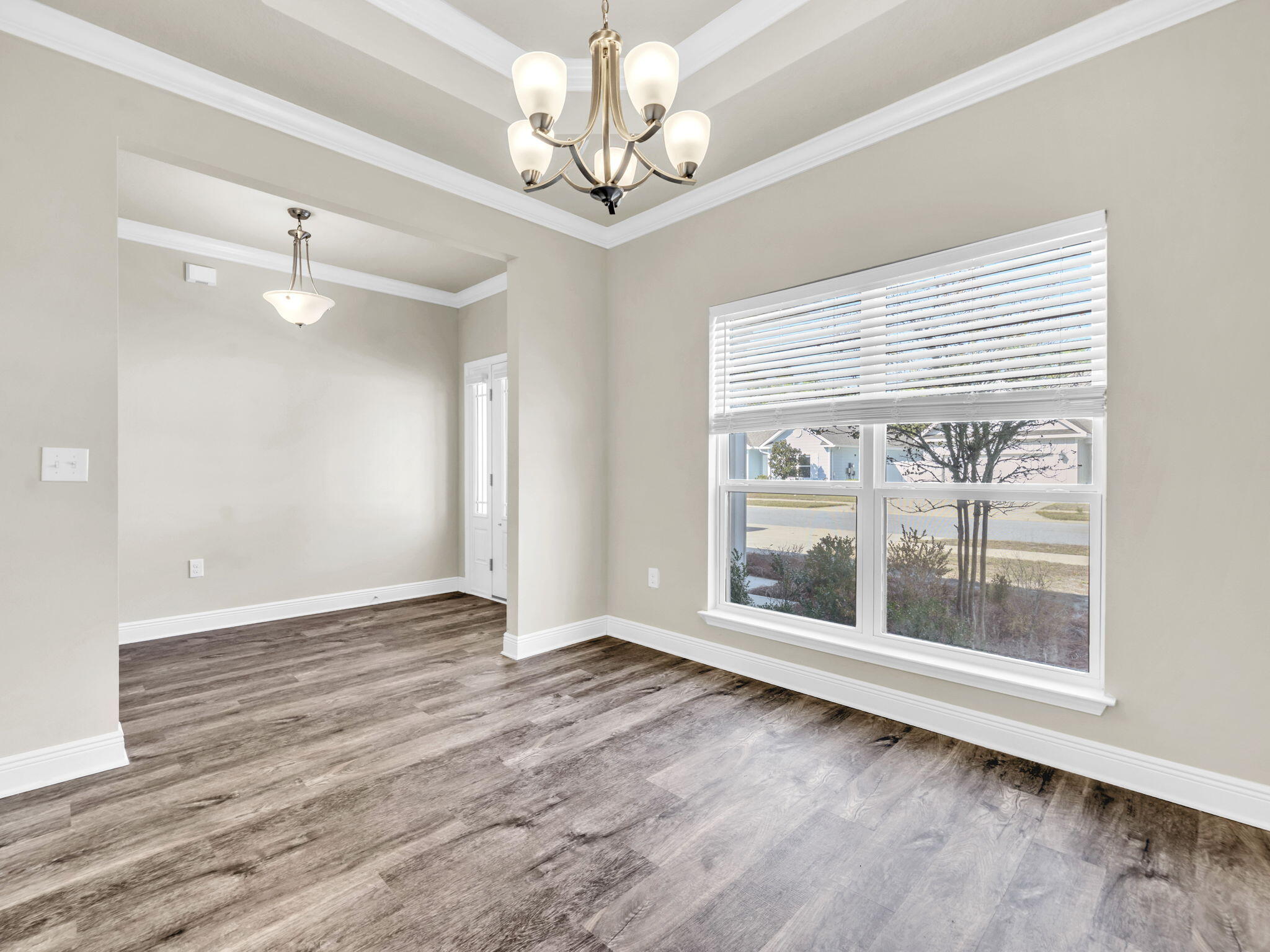 218 Stonegate Drive Santa Rosa Beach, FL 32459 - Photo 10 of 37 a view of an empty room with wooden floor and a window