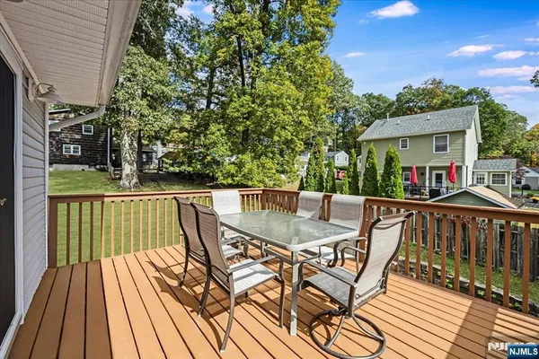 a view of balcony with furniture and wooden deck