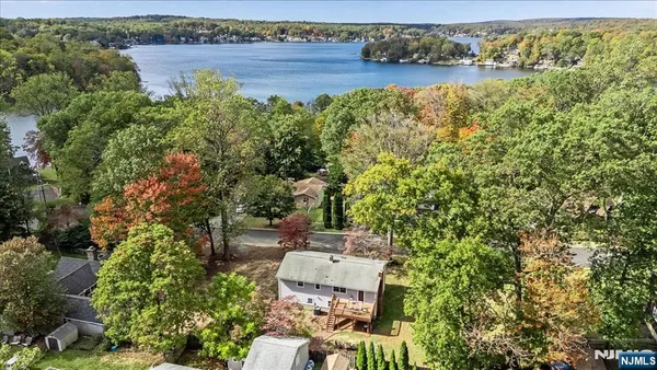 an aerial view of a house with lake view
