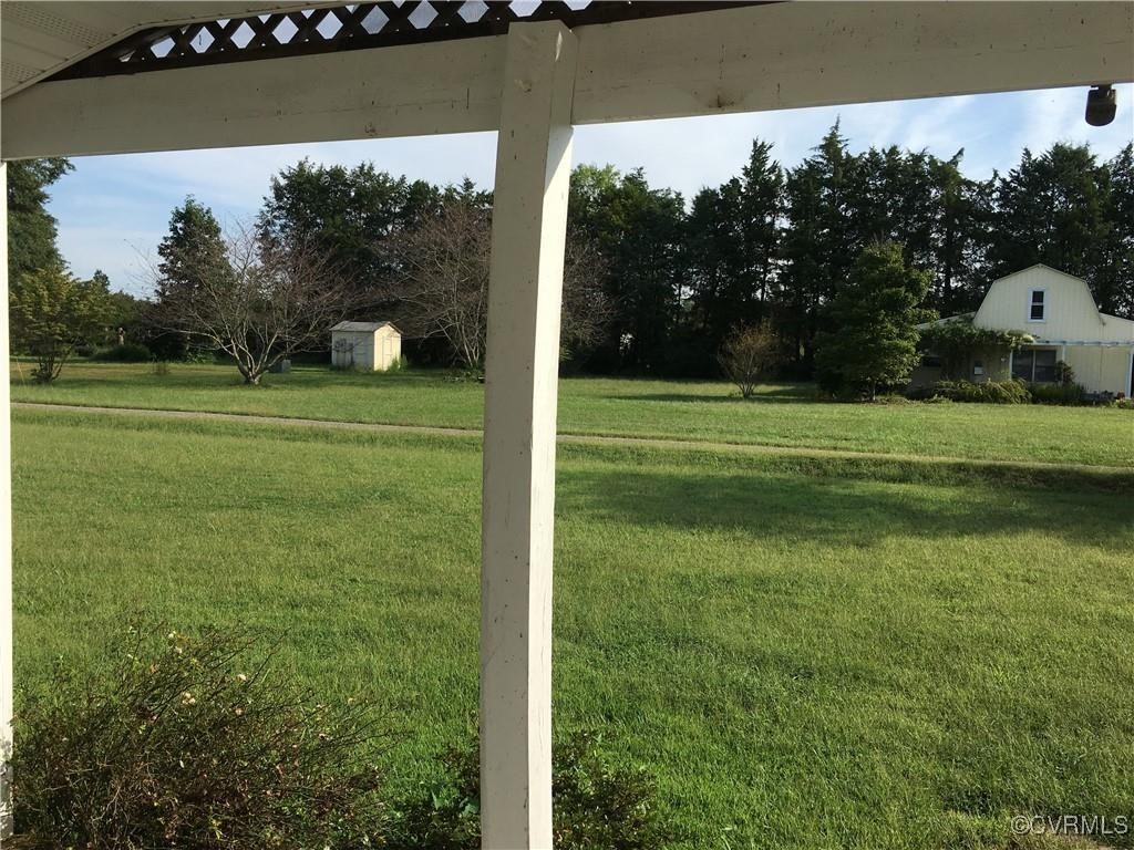 12232 Darbys Road Doswell, VA 23047 - Photo 11 of 20 a view of a golf course with a lake