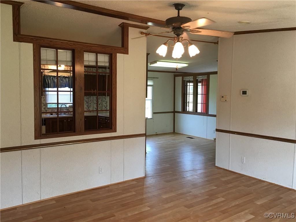 12232 Darbys Road Doswell, VA 23047 - Photo 15 of 20 wooden floor in an empty room with a window