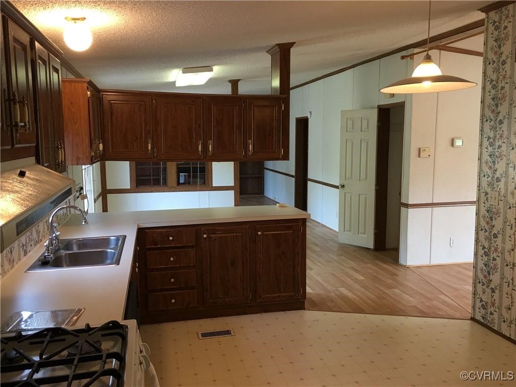 12232 Darbys Road Doswell, VA 23047 - Photo 19 of 20 a kitchen with stainless steel appliances granite countertop a refrigerator and a stove