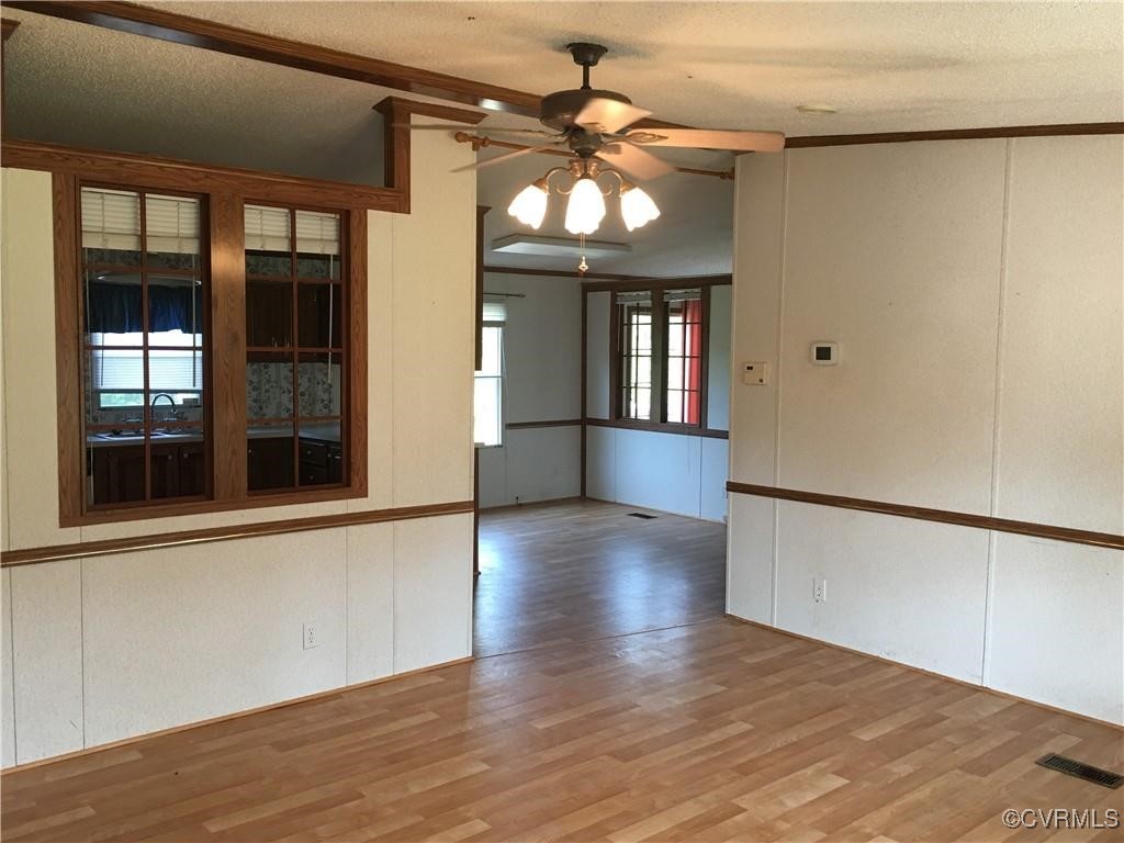 12232 Darbys Road Doswell, VA 23047 - Photo 20 of 20 wooden floor in an empty room with a window