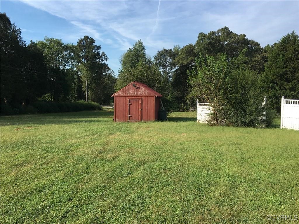 12232 Darbys Road Doswell, VA 23047 - Photo 3 of 20 a house view with a garden space