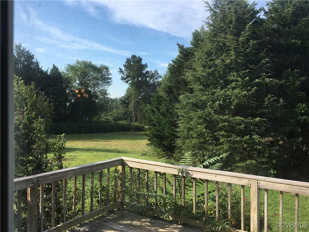 12232 Darbys Road Doswell, VA 23047 - Photo 4 of 20 a balcony with trees in front of it