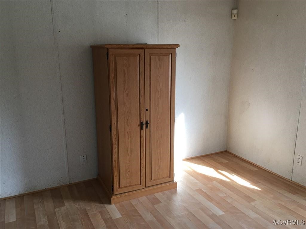 12232 Darbys Road Doswell, VA 23047 - Photo 7 of 20 an empty room with wooden floor