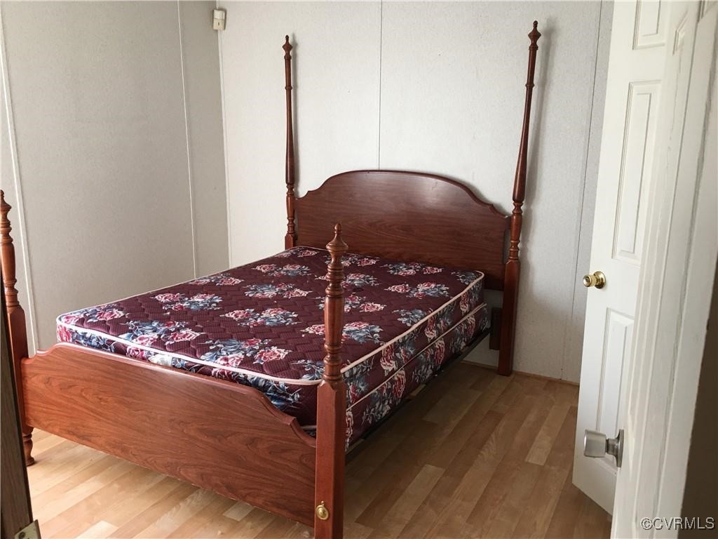 12232 Darbys Road Doswell, VA 23047 - Photo 9 of 20 a bed sitting in a bedroom next to a window