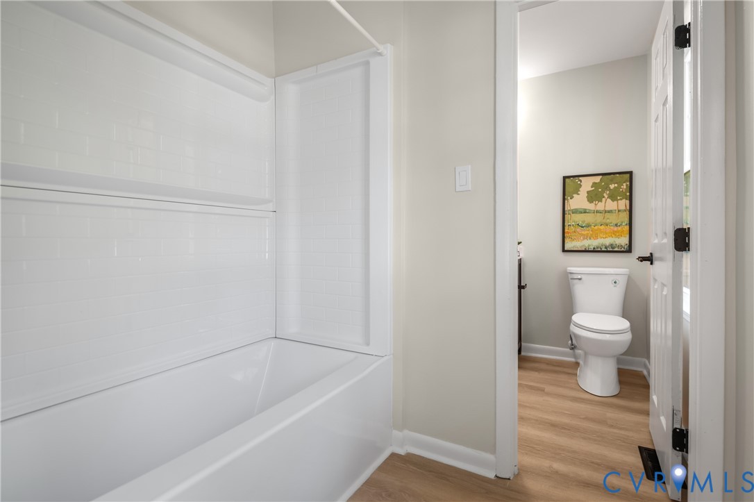 8928 Hawkbill Road North Chesterfield, VA 23237 - Photo 33 of 50 White acrylic tub and shower combination with a ti