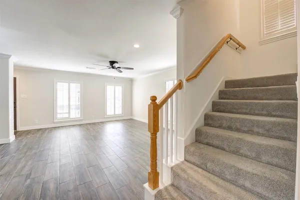 a view of entryway and hall with wooden floor