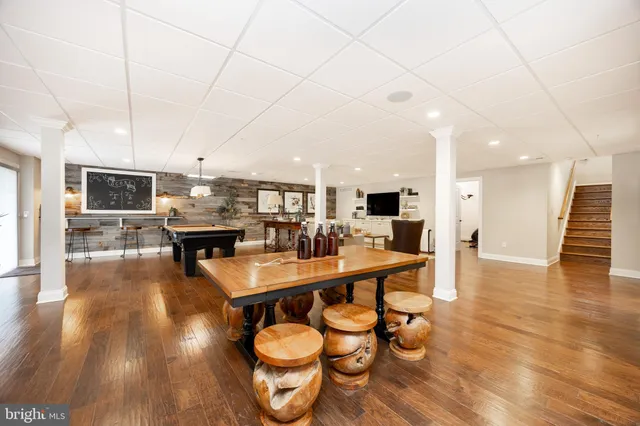 a living room with stainless steel appliances kitchen island granite countertop furniture and a kitchen view