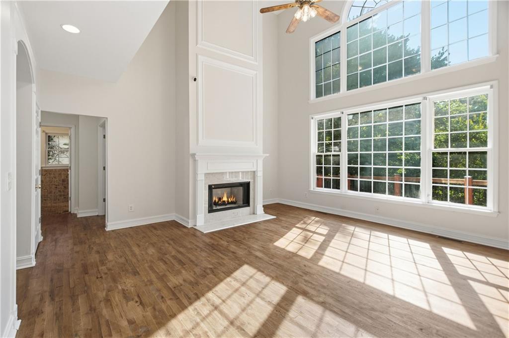 110 Mayes Farm Road Northwest Marietta, GA 30064 - Photo 14 of 49 a view of an empty room with wooden floor and a window
