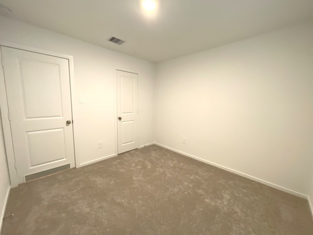 1612 Colina Creek Conroe, TX 77301 - Photo 13 of 33 an empty room with an entryway