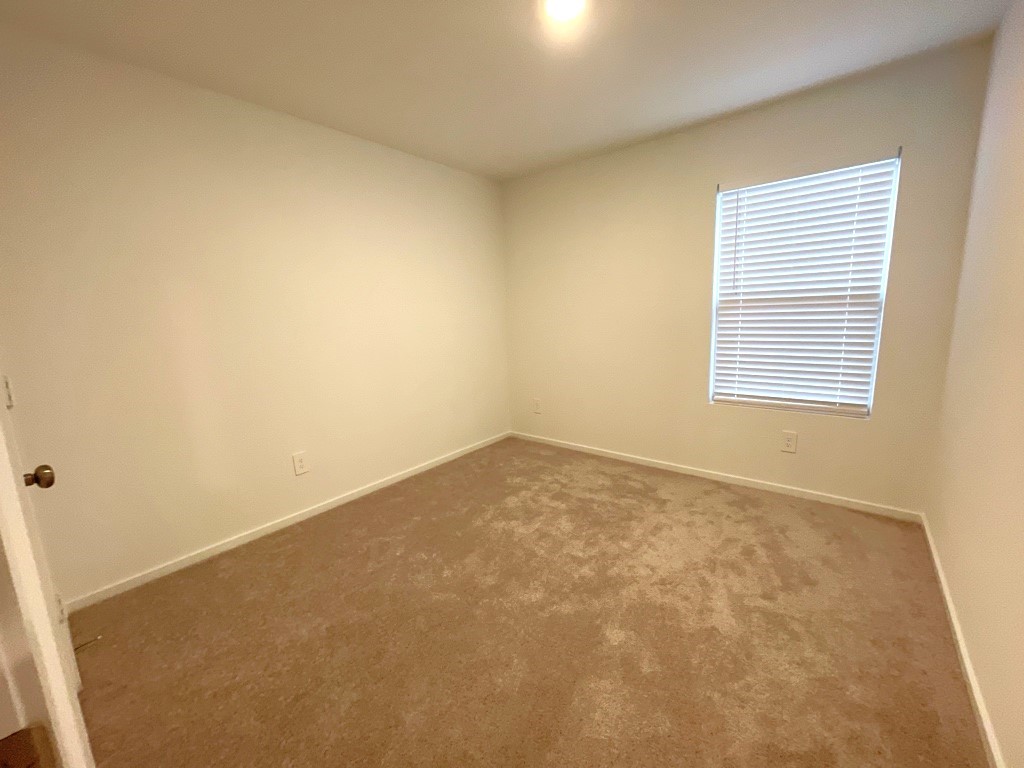 1612 Colina Creek Conroe, TX 77301 - Photo 14 of 33 an empty room with a window