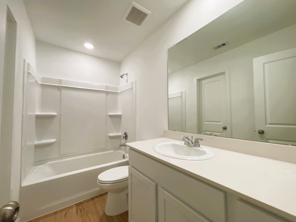 1612 Colina Creek Conroe, TX 77301 - Photo 20 of 33 a bathroom with a sink a toilet and shower