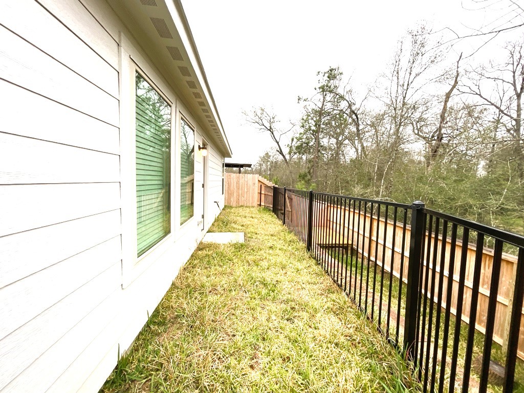 1612 Colina Creek Conroe, TX 77301 - Photo 7 of 33 a view of a balcony with wooden floor