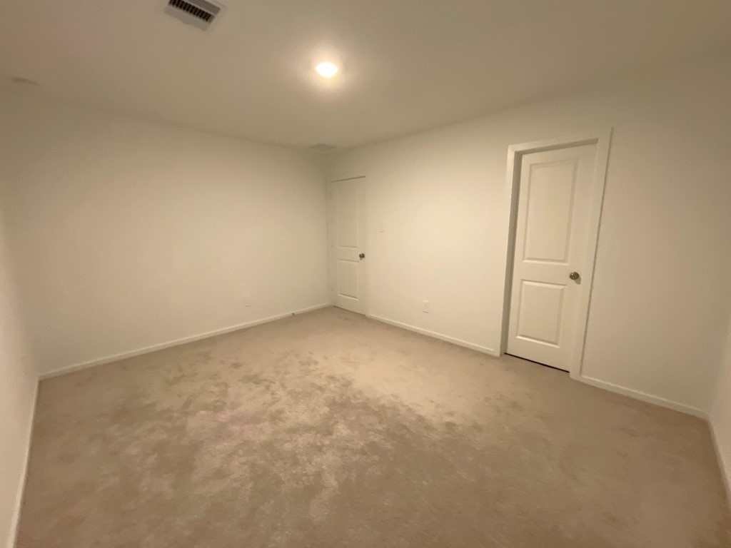 1612 Colina Creek Conroe, TX 77301 - Photo 10 of 33 an empty room with a natural light
