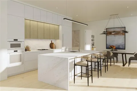 a kitchen with a table and chairs in it
