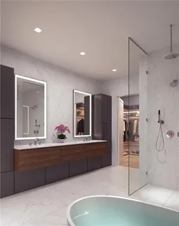 a bathroom with a tub sink and mirror