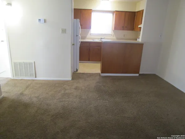 a view of a kitchen with a sink